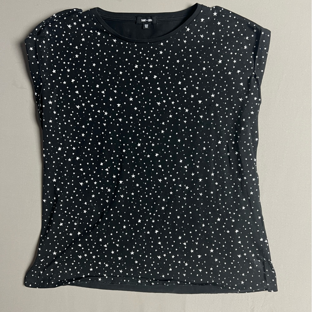 Black tank with white stars.  Stylish yet casual for a warm day.